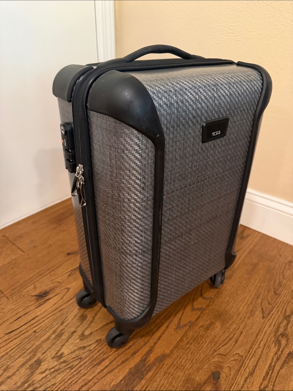 Tumi polycarbonate Gray Textured Hard-Shell Carry-On